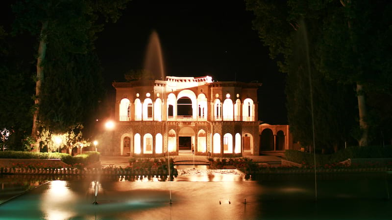 shazdeh garden with beautiful pool and fountain at night in mahan near kerman